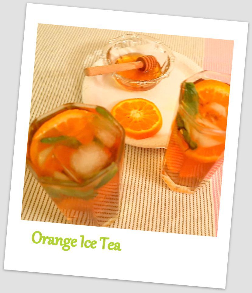 Ice tea with Orange slices and mint leaves